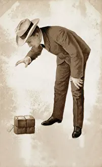 Freans: Chap delighted with his parcel (Peak Frean's Biscuit Box!)