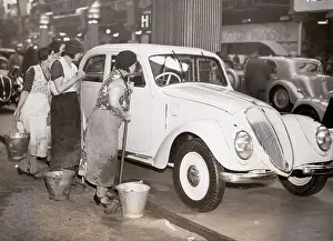Charladies: Charladies examining a luxury limousine