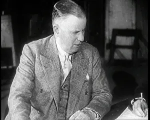 Cochran: Charles B Cochran Sitting at a Table