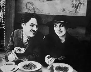 Immigrant: Charles Chaplin and Edna Purviance in The Immigrant, 1916
