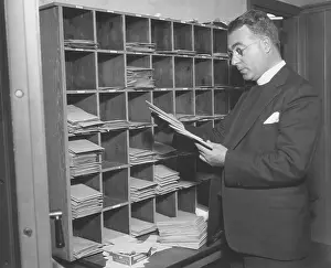 1134: Charles Coughlin looking at his mail in 1934. At