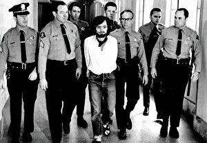 Manson: Charles Manson, 1971, being led away in ?