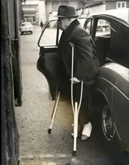 Editing: Charlie Chaplin arriving at Pinewood Studios on crutches