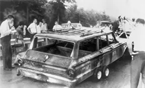 Charred: Charred remains of station wagon driven ?