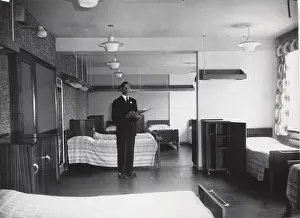 Dormitory: Checking a dormitory at Baden Powell House, London