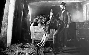 Haulage: Checking the haulage line on a coal wagon in a coal mine