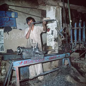 Douglas Dickins: CHECKING RIFLES/PAKISTAN