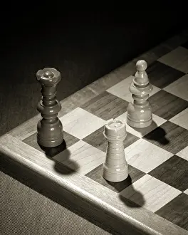 Chessmen: Checkmate Three Chess Pieces Show Opposing Black