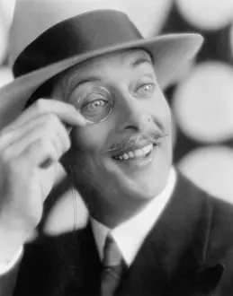Fedora: Cheerful man with monocle