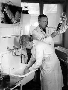 Chemists: Chemist and assistant in a chemistry laboratory