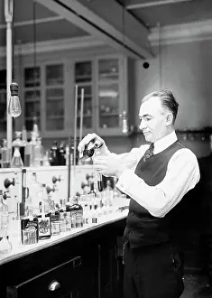 Waistcoat: Chemist G. F. Beyer testing a bottle of bootleg