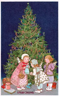 Cherubs with tree and presents on a Christmas postcard
