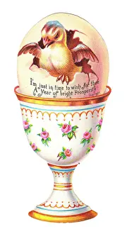 Eggcup: Chick in an eggcup on a cutout New Year card