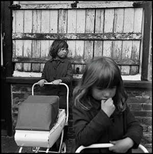 Prams: Chidren in the street with toy prams