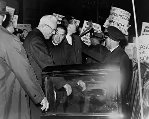 Justices: Chief Justice Earl Warren is escorted through ?