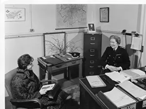 Epaulettes: Chief Superintendent Winifred Barker in her office