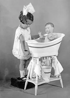 Stuffed: Child with doll, 1927