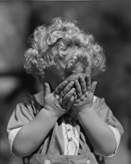 Camerique: Child with hands to face
