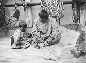 Whalers: Child learning to smoke a pipe, native American ?