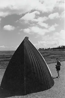 The John Krish Collection: Child looking at the cut off bow of a boat