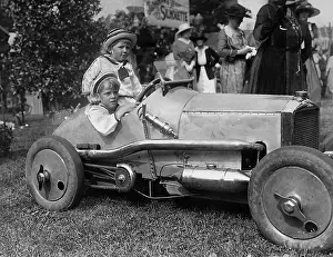 Reaches: Child in a racing car