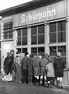Destitution: Child refugees in Post-war Germany at a shop window