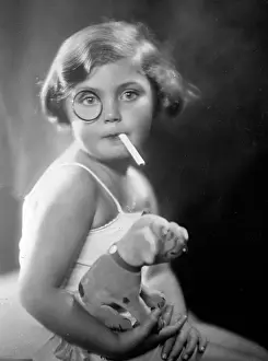 Monacle: Child Smoking Cigarette