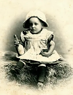Habits: Child smoking pipe