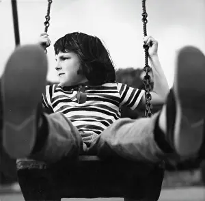 Soles: Child on a swing