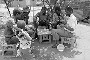 Shebeen: Child watching shebeen players in Tembisa