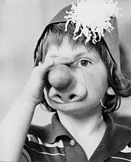 Nostrils: Child wearing a party mask and hat