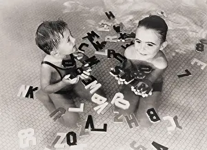 Childern: Childern with wooden letters