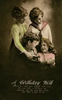 Wishing: Four children on a birthday postcard