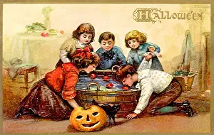 Bobbing: Children bobbing for apples in a barrel