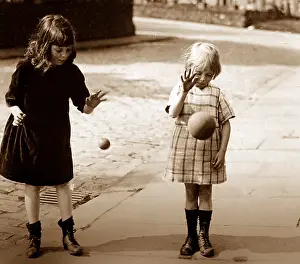Bouncing: Children bouncing balls, early 1900s