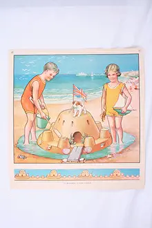Sandcastle: Children building a sandcastle, yellow bathing