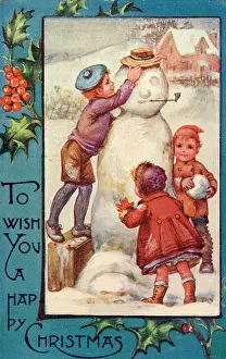Completing: Three children completing their snowman