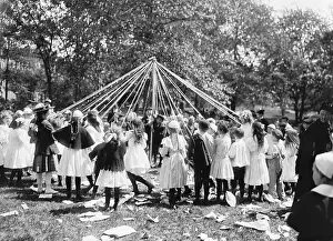 Sweaters: Children dancing around a Maypole, Central
