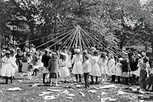 Maypole: Children dancing around a Maypole in Central Park in New Yor