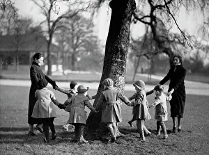 Nurseries: Children dancing around a tree