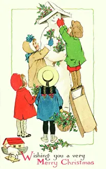 Decorate: Children decorate a snowman