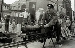 Fete: Children enjoy a ride on a model steam train