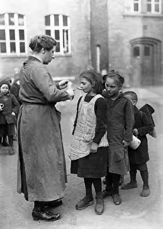 Strengthening: Children are fed with cod liver oil, 1919