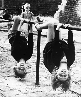 Sticking: Children hanging upside down
