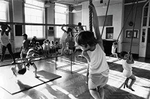 Vests: Children having a PE lesson in the school gym