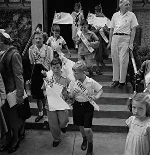 Cheering: Children leaving the Sunday school of the