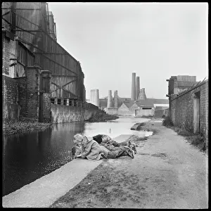 Towpath: Children lying on the towpath looking into the Caldon Canal