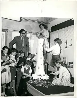 Children making giant model lighthouse from matchboxes