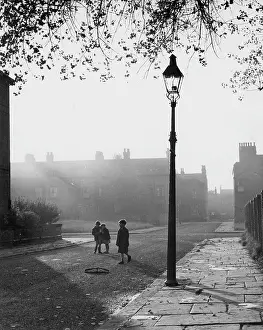 Roadway: Children in a misty street