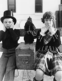 Sibling: Two children and a monkey playing hear no evil